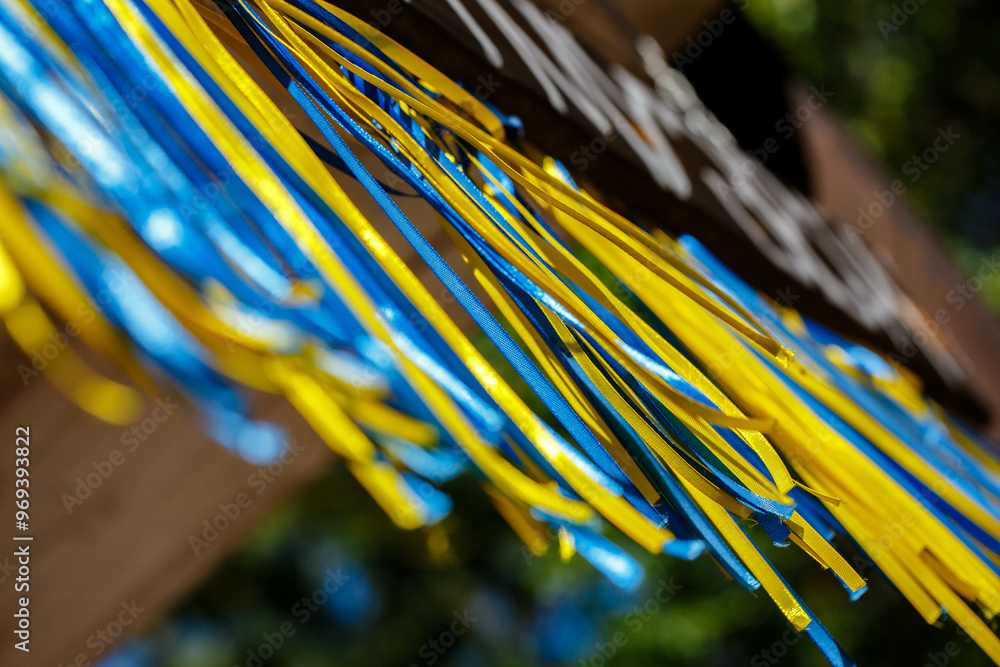 Colorful blue and yellow ribbons through the sun's rays
