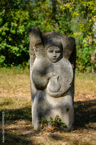 The figure of the ancient gods on the stones in the autumn park. Ukraine. Scythian culture