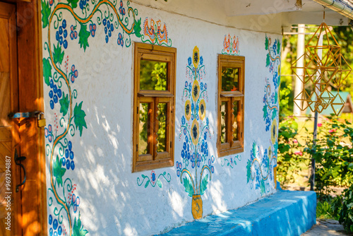 Ukrainian house painted with floral patterns in ancient technique photo