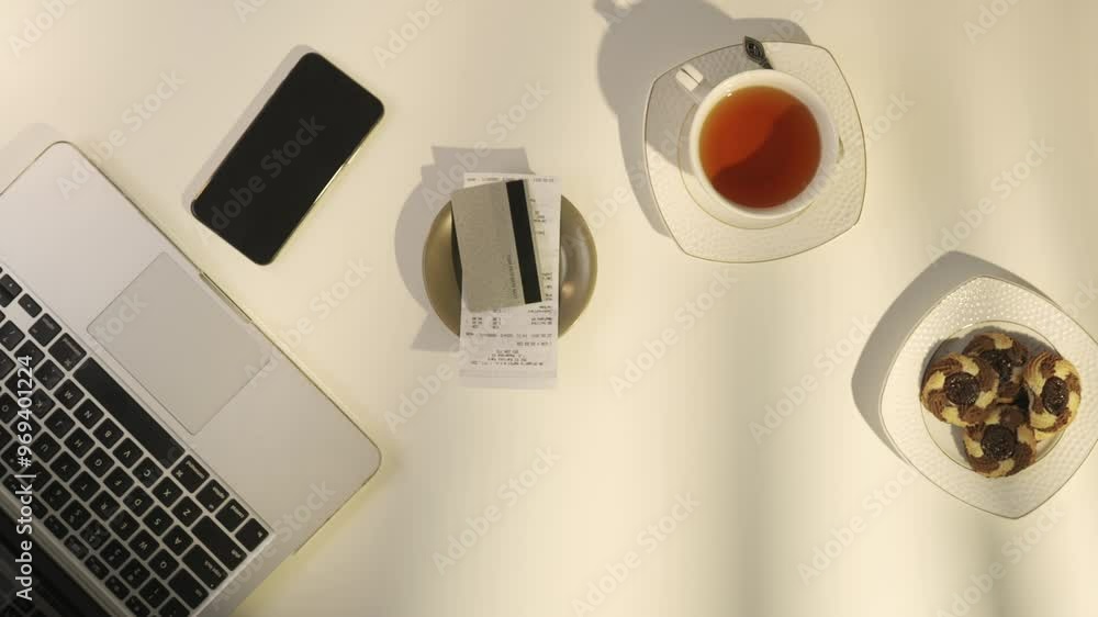 Top view of man hand receiving paying bill at cafe or restaurant putting bank credit card on the plate with receipt. Top view of man hand receiving paying bill at cafe or restaurant putting bank credit card on the plate with receipt.
