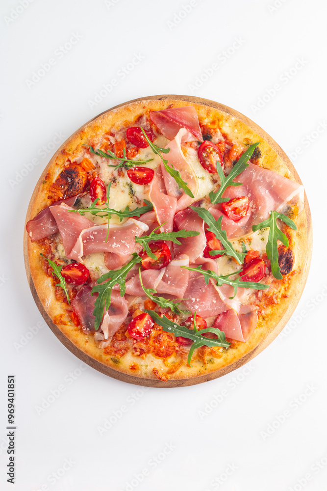 Pizza with prosciutto, ham, arugula, spinach, tomatoes, pesto, cheese and parmesan. Italian cuisine. Pizza with prosciutto, ham, arugula, spinach, tomatoes, pesto, cheese and parmesan. Italian cuisine.