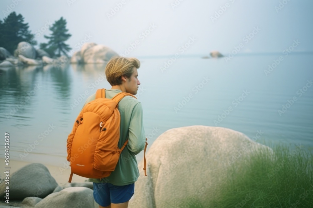 Fototapeta premium Backpacker on the lake shore