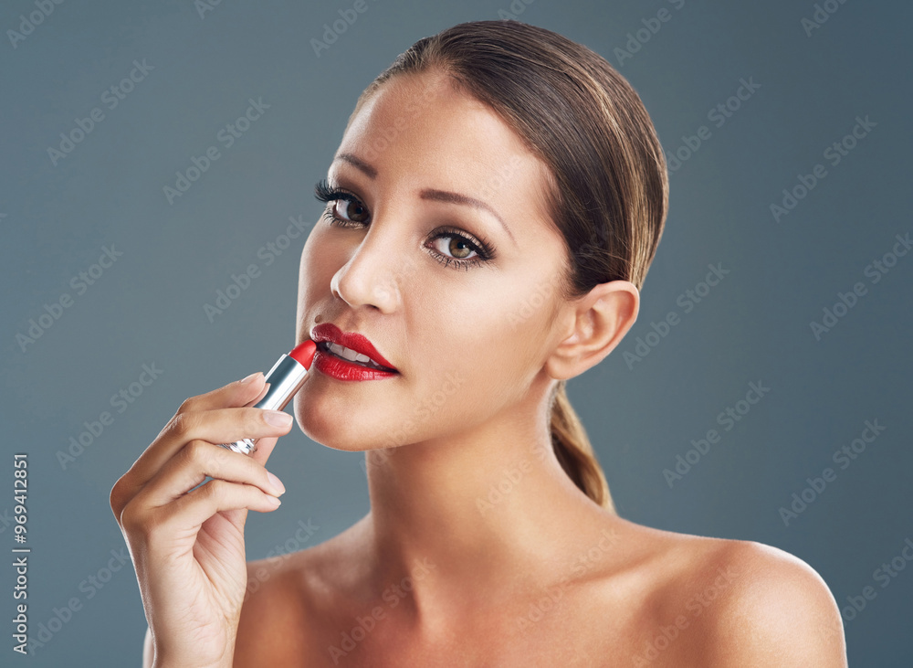 Beauty, red lipstick and makeup with portrait of woman in studio for glamour, cosmetics and cosmetology. Foundation, artist and product with female person on gray background for glow, shine or salon Beauty, red lipstick and makeup with portrait of woman in studio for glamour, cosmetics and cosmetology. Foundation, artist and product with female person on gray background for glow, shine or salon