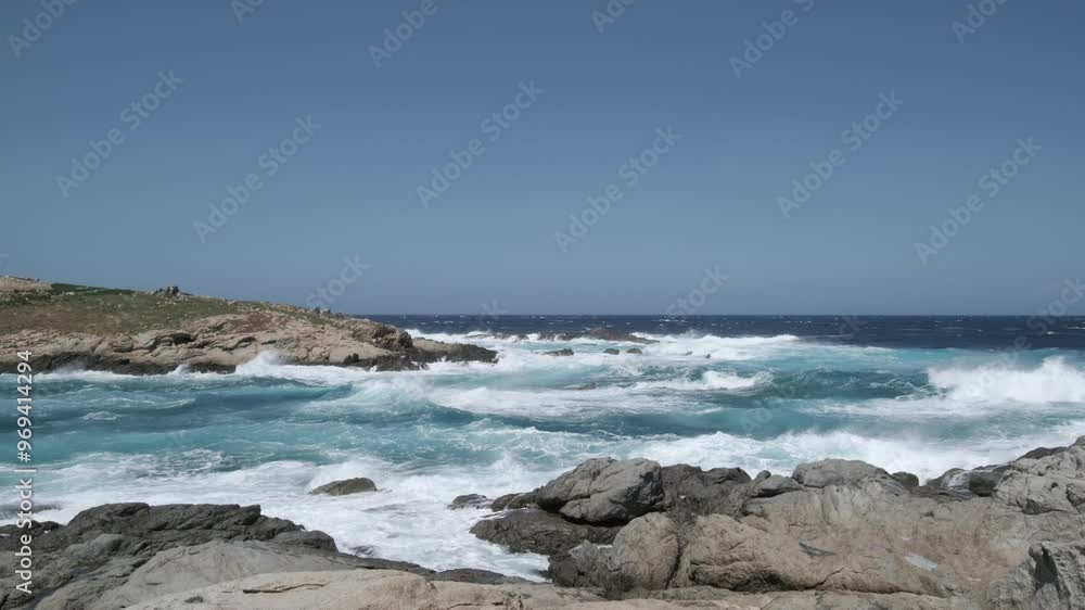 Rough Mediterranean sea crashing onto the rocks at Punta Spano near Lumio on the island of Corsica Rough Mediterranean sea crashing onto the rocks at Punta Spano near Lumio on the island of Corsica