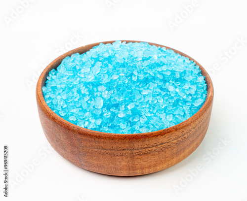 Blue Salt Crystals in Bowl Isolated, Bath Salt for Spa Relax, Cupric Sulfate or Copper Sulfate, Swimming Pool photo