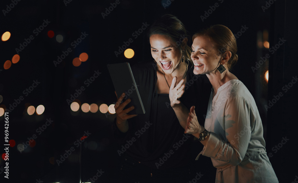 Business people, night and women with tablet, excited and planning with email, deadline and happiness. Evening, employees and coworkers with tech, internet and research with cooperation for project Business people, night and women with tablet, excited and planning with email, deadline and happiness. Evening, employees and coworkers with tech, internet and research with cooperation for project