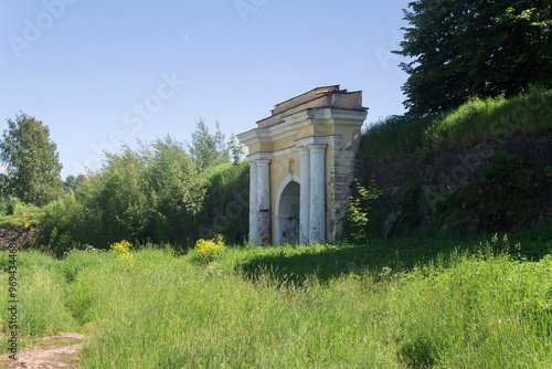 arch with gate, ruins of ancient fortifications photo