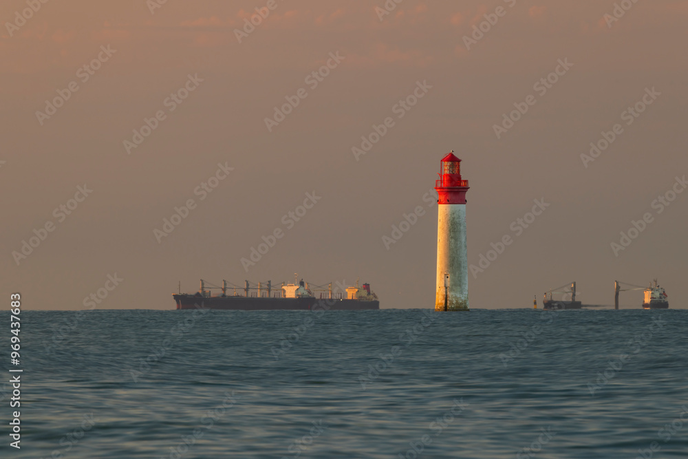 Phare de Chauvea near Ile de Re with ships to La Rochelle, Pays de la Loire, France Phare de Chauvea near Ile de Re with ships to La Rochelle, Pays de la Loire, France