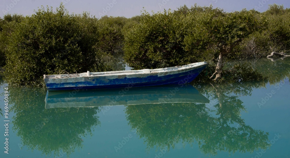 Floating Boat Beside Mangrove Trees: Unique Harmony and Serenity in Calm Waters Floating Boat Beside Mangrove Trees: Unique Harmony and Serenity in Calm Waters
