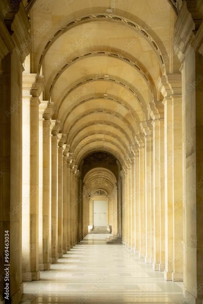Elegant corridor with arches and columns in a historic building. Elegant corridor with arches and columns in a historic building.