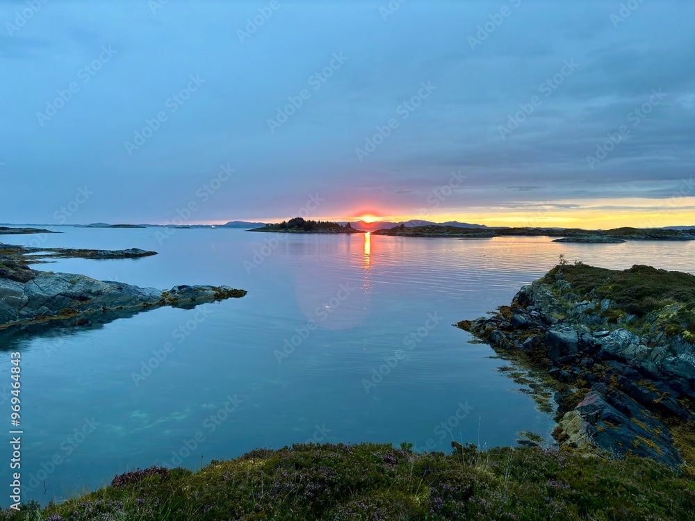 Sunrise over the island of Smoela, Norway, on a cloudy morning Sunrise over the island of Smoela, Norway, on a cloudy morning