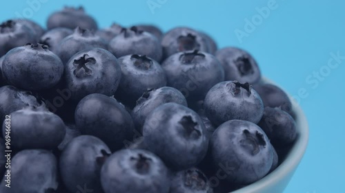Blueberries in the bowl-blue background