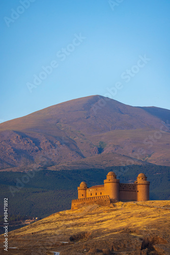 La Calahorra castle with Sierra Nevada, Andalusia, Spain photo