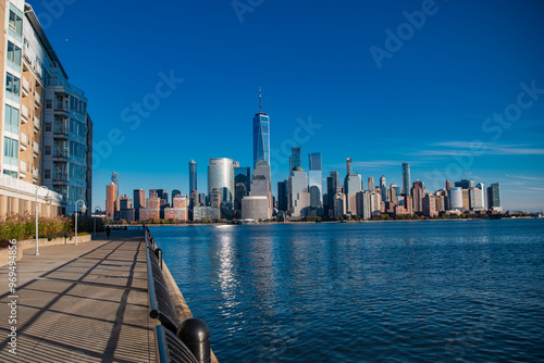 NYC, NY. New York City Skyline with Urban Skyscrapers USA. Lower Manhattan and One World Trade Center in New York City, USA as seen from Weehawken New Jersey Panoramic view on Manhattan.