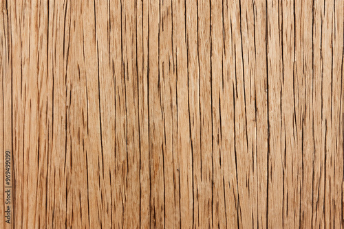 Close-up of a rustic weathered wood surface with vertical grain patterns and natural cracks.