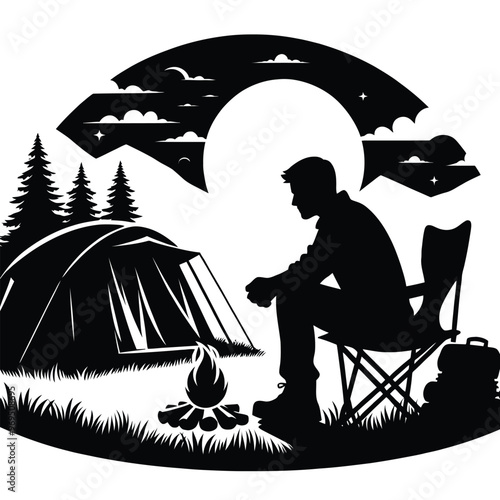 A silhouette of a person camping in the wilderness