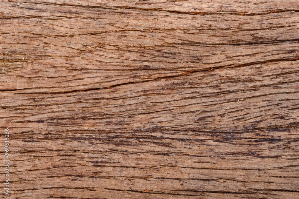 Close-up of brown wood grain texture with natural knots and lines. Close-up of brown wood grain texture with natural knots and lines.