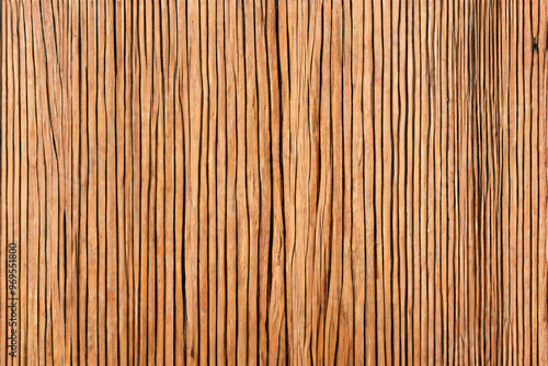 Close up of a brown wooden fence made of vertical, thin slats.