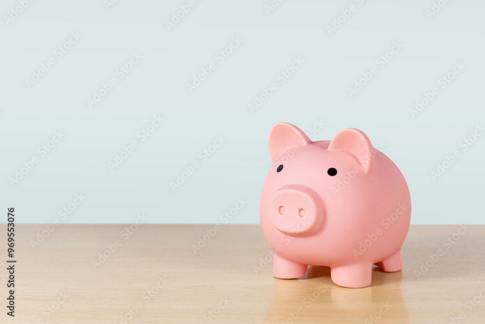 Piggy bank, save, invest and saving success in the future goal. Piggy bank on table in the office Piggy bank, save, invest and saving success in the future goal. Piggy bank on table in the office