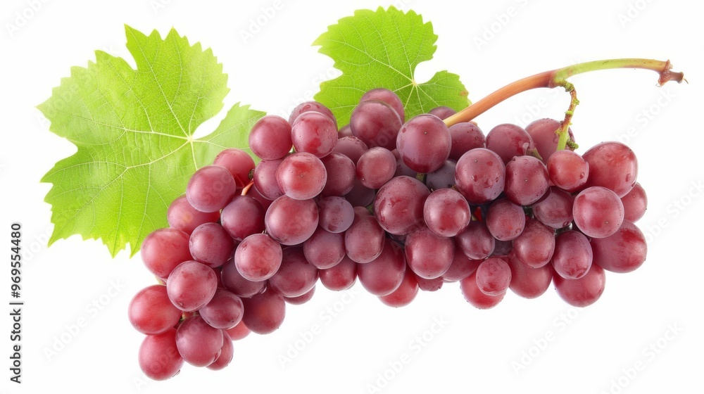Fototapeta premium Close-up of a Bunch of Red Grapes with Green Leaves