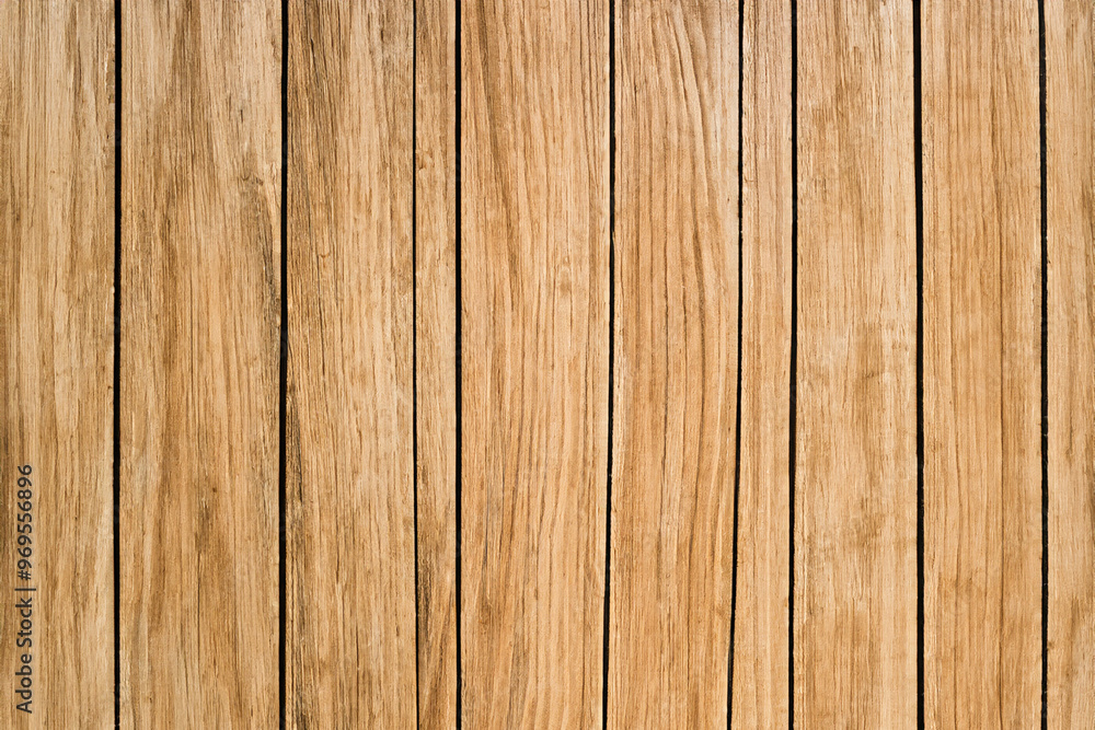 Close-up of natural wood planks with horizontal grain, showing the texture and color of the wood. Close-up of natural wood planks with horizontal grain, showing the texture and color of the wood.