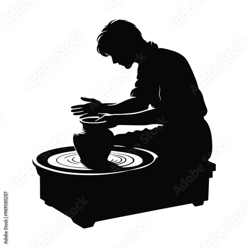 Silhouette of a person making pottery