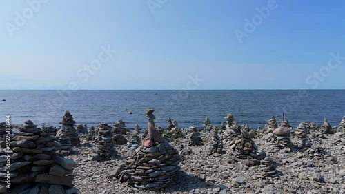 Stone Towers Beach Estonia (Baltic States), Saaremaa Island, Pyramids of Flat Stones Put as Lucky Charm Along the Beaches of the Southwest Pebble Beach, Ohessaare Tuulik, Kivi Rand Saaremaa, Estonia photo