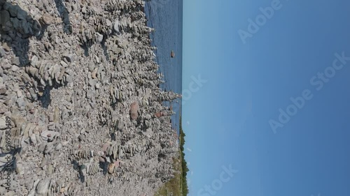 Stone Towers Beach Estonia (Baltic States), Saaremaa Island, Pyramids of Flat Stones Put as Lucky Charm Along the Beaches of the Southwest Pebble Beach, Ohessaare Tuulik, Kivi Rand Saaremaa, Estonia photo