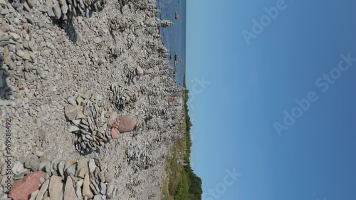 Stone Towers Beach Estonia (Baltic States), Saaremaa Island, Pyramids of Flat Stones Put as Lucky Charm Along the Beaches of the Southwest Pebble Beach, Ohessaare Tuulik, Kivi Rand Saaremaa, Estonia photo