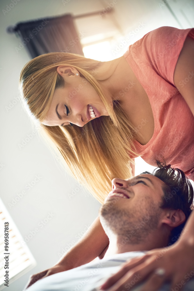 Fototapeta premium Love, morning and relax with couple in bedroom for romance, bonding and marriage. Honeymoon, getaway and house rental with man and woman on holiday or staycation for anniversary retreat and wake up