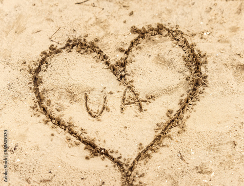 Heart drawn in sandLove UkraineHeart with Ukraine middle 