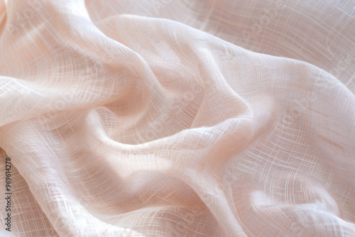 Soft beige sheer fabric with gentle folds and textured weave