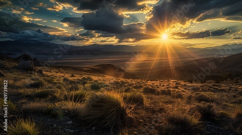 Sunrise over the Toiyabe Mountains with golden light illuminating the rugged terrain along the Nevada Loneliest Road in America photo