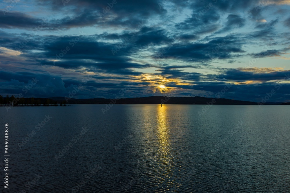 Serene sunset over a calm lake Vasman in Ludvika. Serene sunset over a calm lake Vasman in Ludvika.