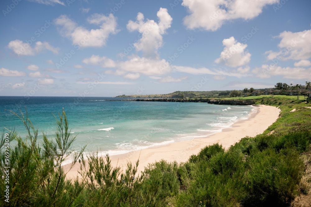 Tropical beach with clear blue water and lush greenery. Tropical beach with clear blue water and lush greenery.