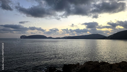 sunset in the bay of porto conte near alghero
