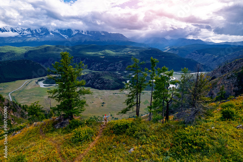 Adventure phototrip travel, man photographer with camera taking photo of Landscape Altai with winding River meander in mountains, aerial top view. photo