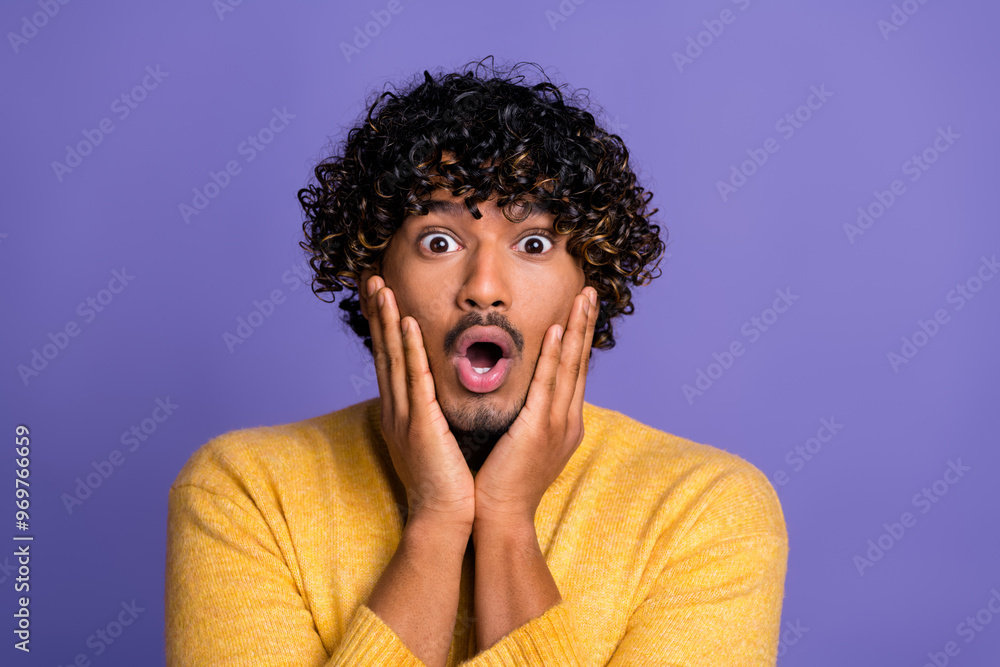 Photo of impressed shocked man wear trendy yellow clothes win winner wow isolated on violet color background Photo of impressed shocked man wear trendy yellow clothes win winner wow isolated on violet color background