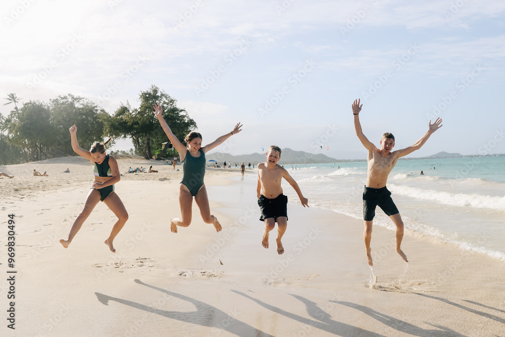 Four kids playing on beach during family vacation. Four kids playing on beach during family vacation.