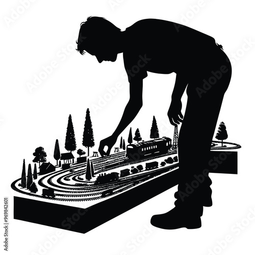 Silhouette of a person engaging in model railroading