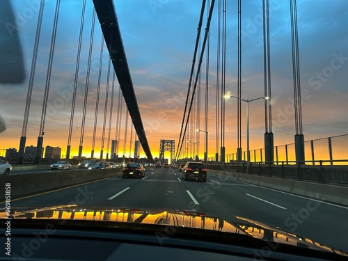 A car ride through NYC bridge during sunset