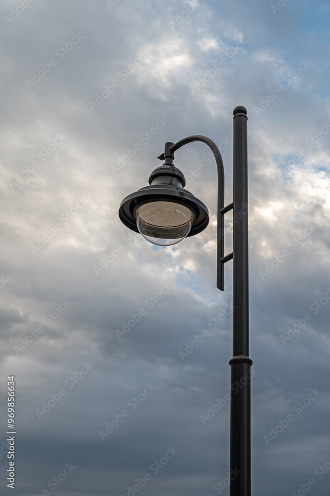 Street light on background of sunset cloudy sky. Street light on background of sunset cloudy sky.
