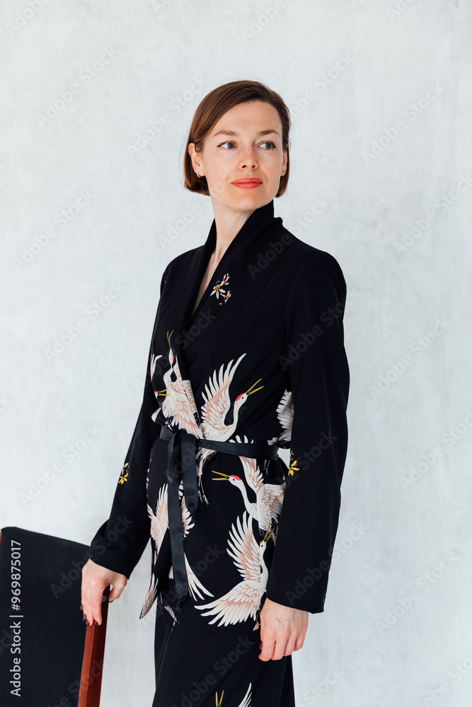 Beautiful fashionable woman 40 years old in black silk suit Beautiful fashionable woman 40 years old in black silk suit