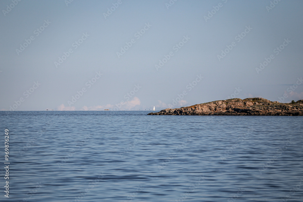 A barren rock rises above the Baltic Sea in Sweden.