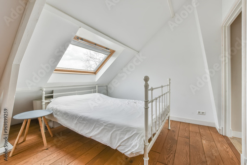 Cozy attic bedroom with a skylight window