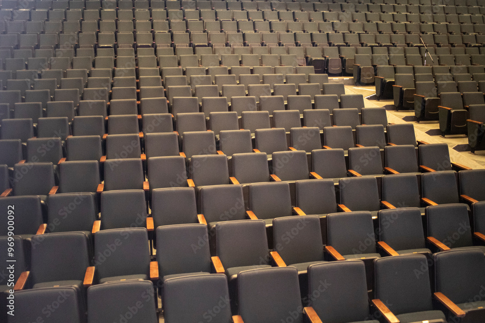 Fototapeta premium Empty seats in the auditorium. Seats for spectators. Rows of seats.