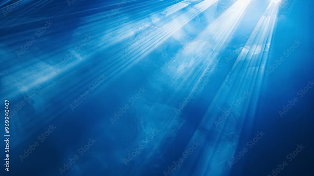 Obraz premium Beams of spotlight on a royal blue background.