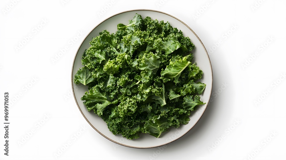 Fresh kale on white plate - top view of healthy green leaves Fresh kale on white plate - top view of healthy green leaves