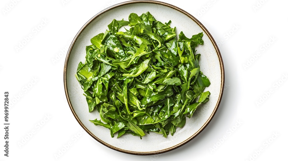 Fresh arugula salad on white plate - healthy green leafy vegetables Fresh arugula salad on white plate - healthy green leafy vegetables