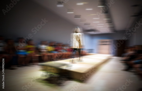 Obraz na płótnie Fashion Show Runway with Model Walking in Blurred Motion on a ramp, cat walk w salonie